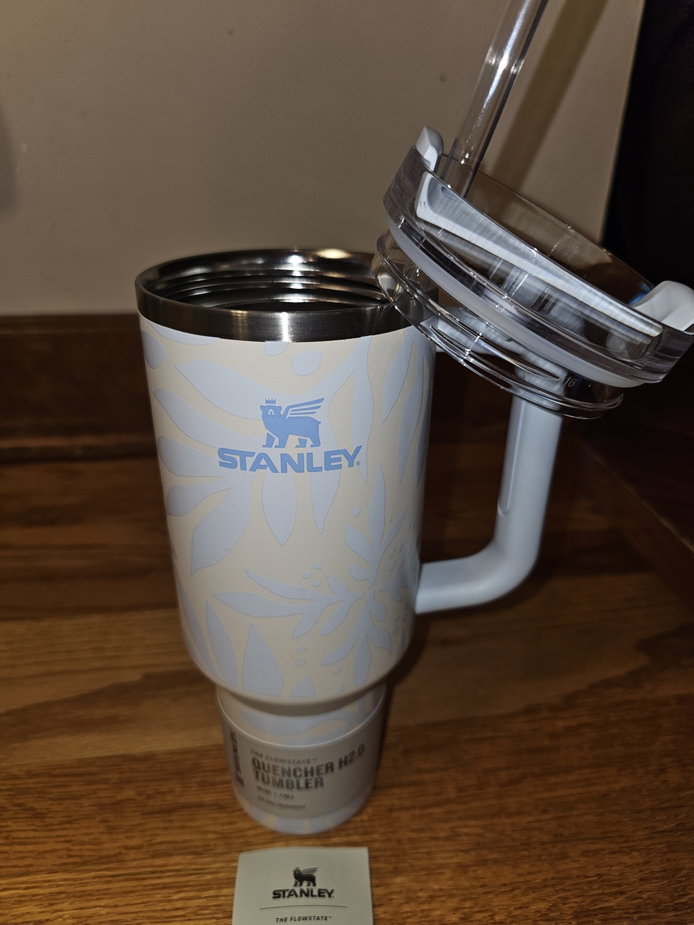 Stanley 40 Oz Ocean Palm Cream Tumbler with Light Blue Logo and Floral Pattern